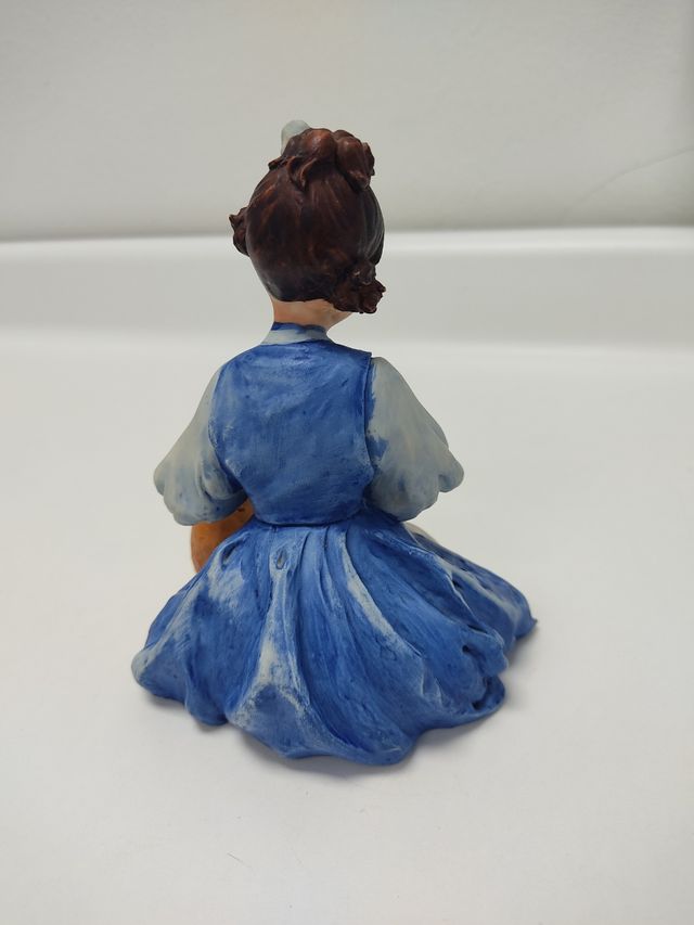 Figura niña sentada con perro colecionismo