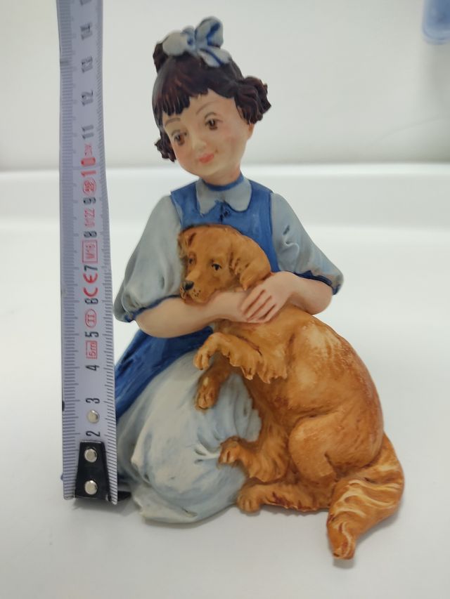 Figura niña sentada con perro colecionismo