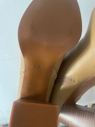 botas altas de piel mosqueteras