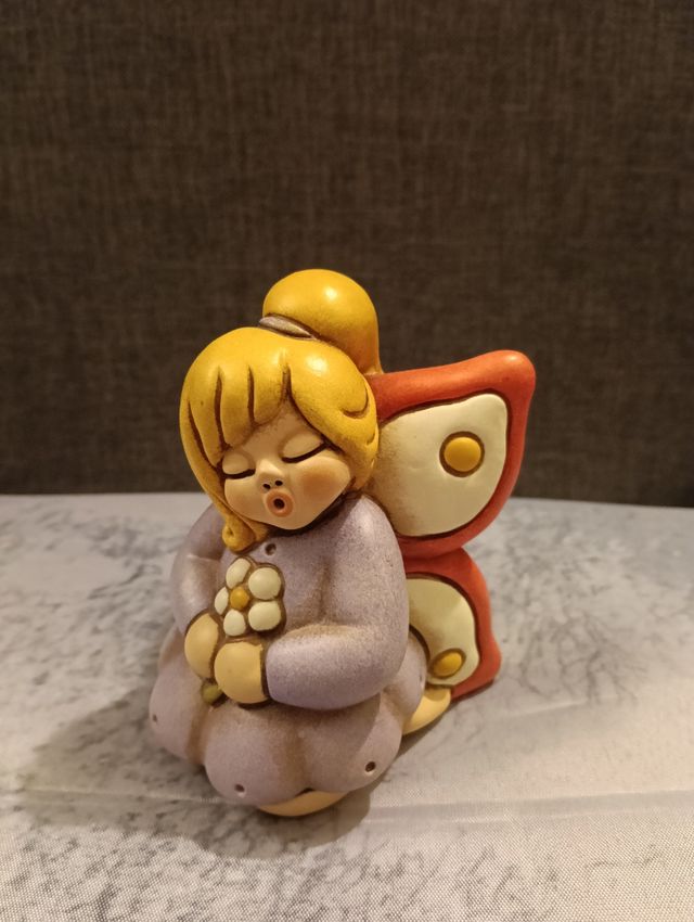 Fata lilla con fiore Thun