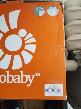 Canguro porta-bebes con su caja