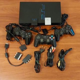 PS2 Consola y 2 micrófonos Regalo Buzz y 4 mandos