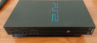 PS2 Consola y 2 micrófonos Regalo Buzz y 4 mandos