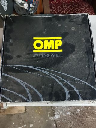 Volante desplazado OMP original.