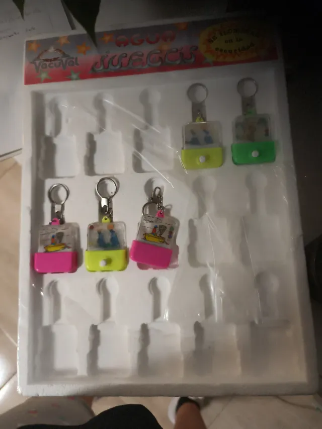 2 llaveros juegos de agua vacuval