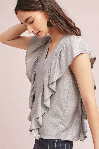 Top gris plateado con volantes de Anthropologie XS