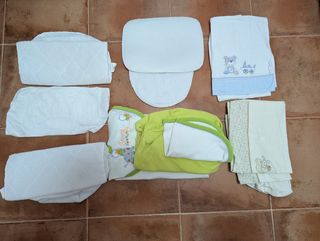 Rulo, cojín anti vuelco, varias sábanas capazo 