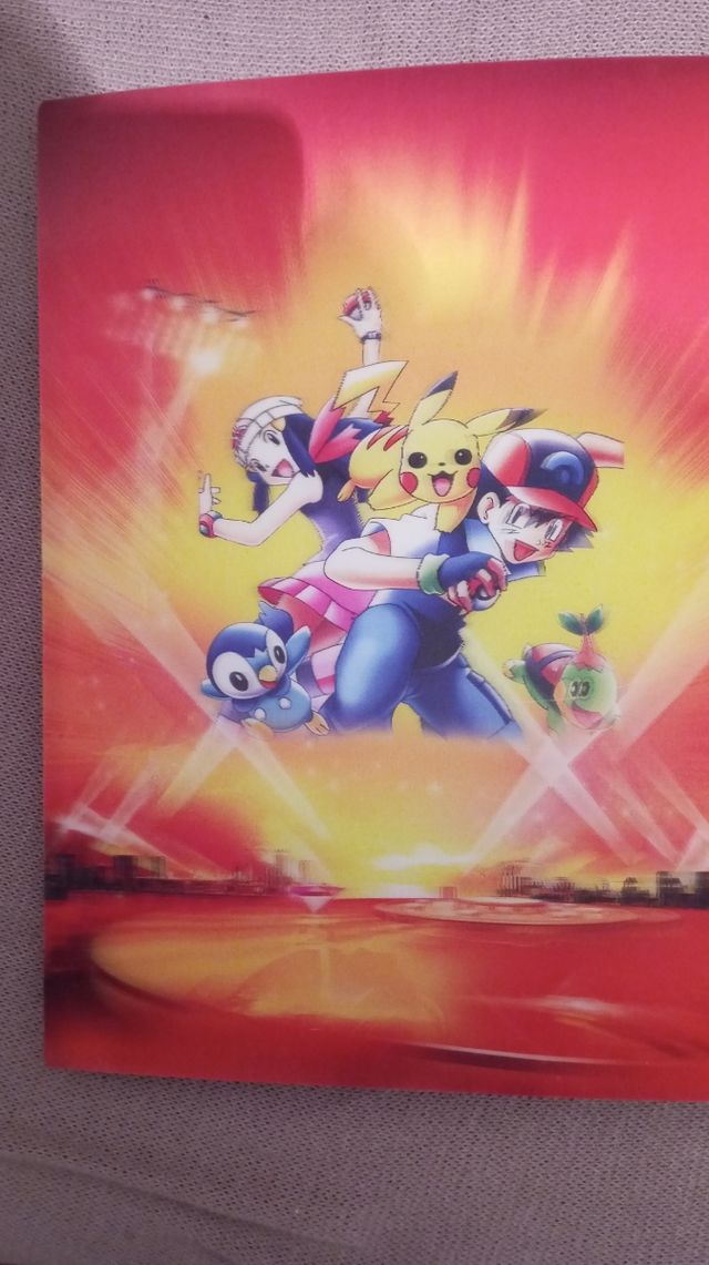 Album de POKEMON TRADING.Lleno de cromos.