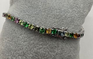 Pulsera riviere de 18 kt con gemas