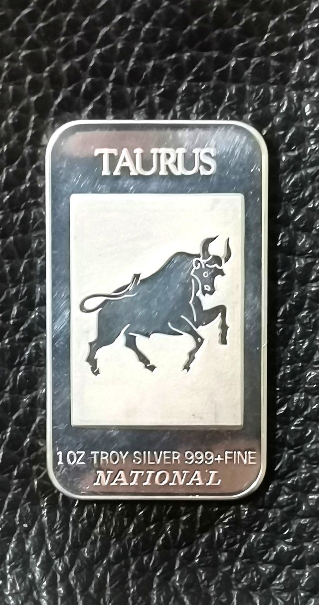 Moneda rectangular, onza de plata.