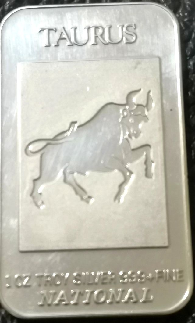Moneda rectangular, onza de plata.