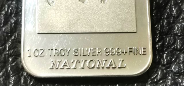 Moneda rectangular, onza de plata.