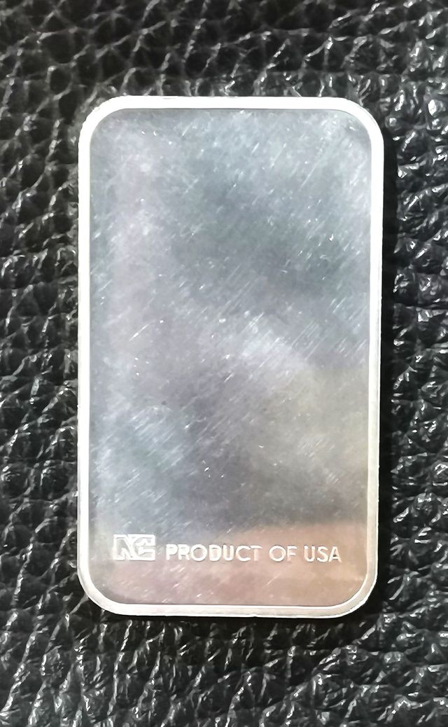 Moneda rectangular, onza de plata.