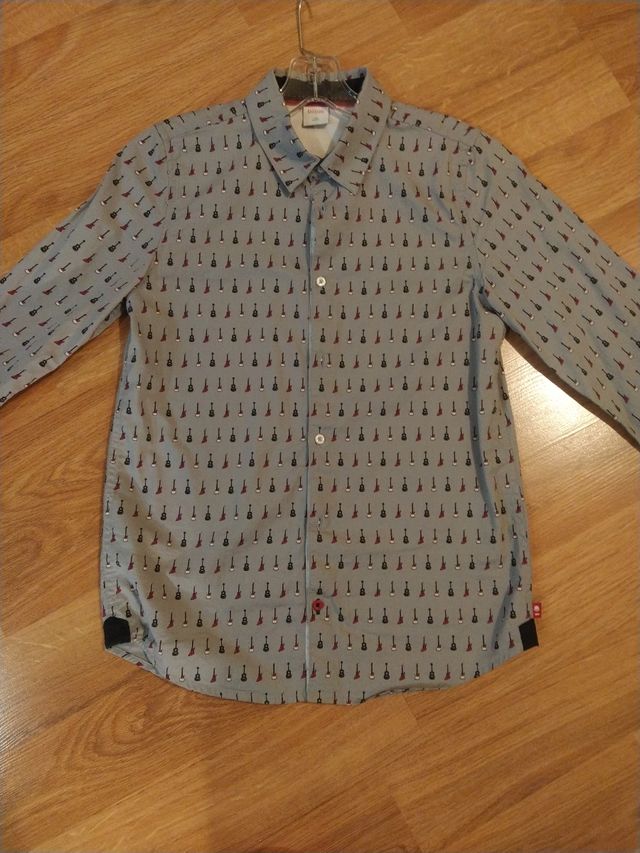 Camisa gris guitarras 14 años