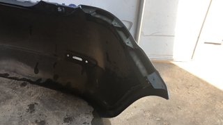 PARAGOLPES TRASERO FORD FIESTA 2005 GRIS OSCURO