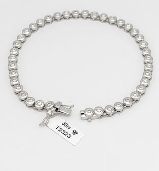 Pulsera Riviere chatones de Oro de 18k.