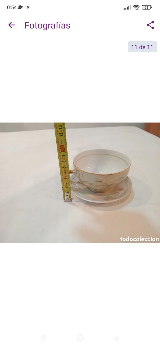 Antigua taza de porcelana fina reflejos