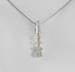 Colgante Tous en oro blanco 18k y diamantes