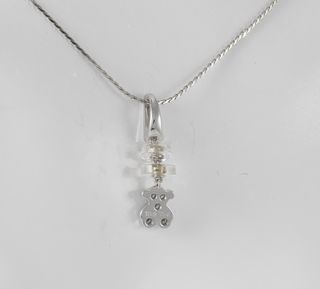Colgante Tous en oro blanco 18k y diamantes
