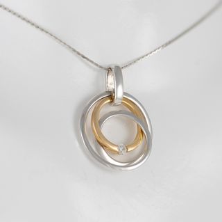 Colgante en oro amarillo y blanco 18k y brillante