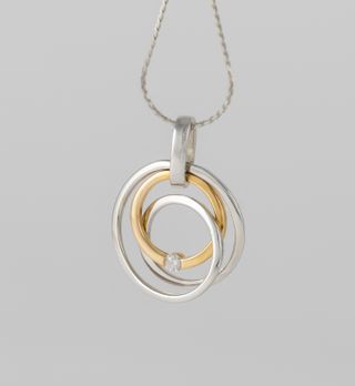 Colgante en oro amarillo y blanco 18k y brillante