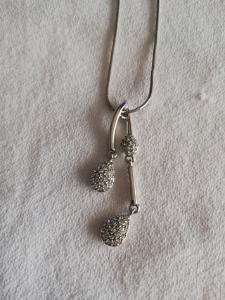 Colgante de acero y brilli brilli 