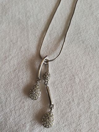 Colgante de acero y brilli brilli 