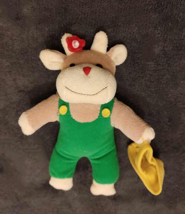 Mucca in peluche con borsa gialla