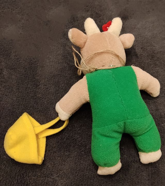 Mucca in peluche con borsa gialla