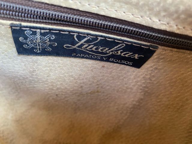 Cartera de mano de piel