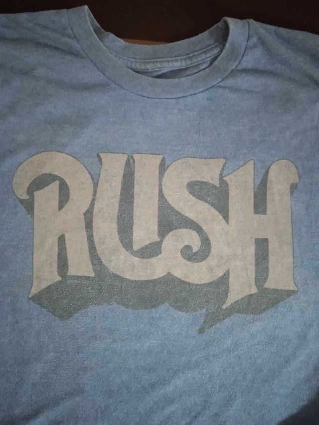 Camiseta oficial logo banda Rush. Azul. Vintage.