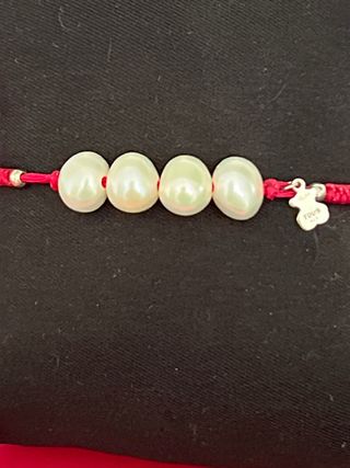 Pulsera d Tous cuerda fucsia y perlas