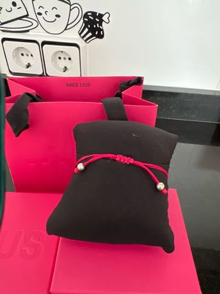 Pulsera d Tous cuerda fucsia y perlas