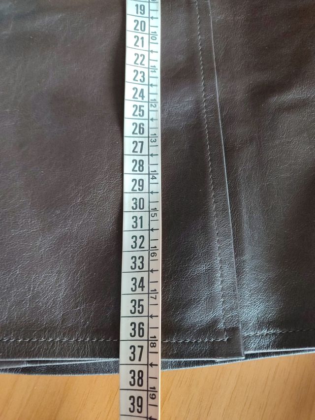 Minigonna in pelle nuova, a portafoglio