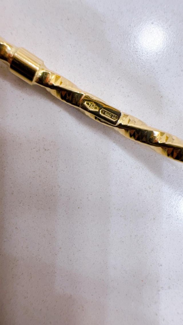 Bracciale rigido intrecciato in oro 18kt 750