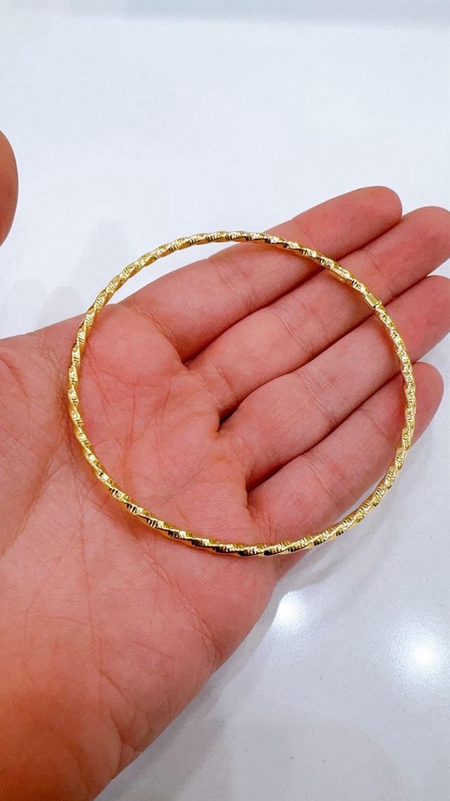 Bracciale rigido intrecciato in oro 18kt 750
