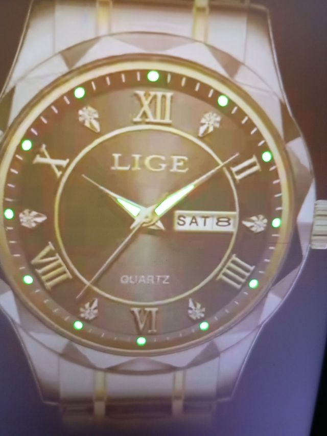 Relog lige  cuarzo .hombre