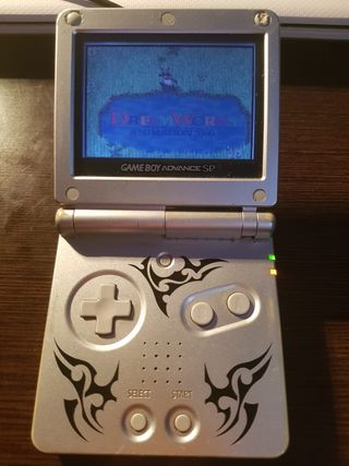 Gameboy advance sp tribal con cargador y juegos