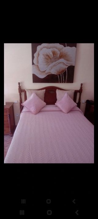 Colcha reversible rosa y verde y un mándala