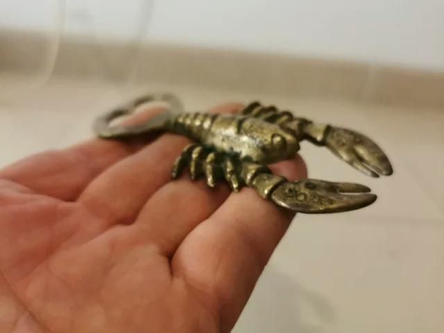 decoración abrebotellas de metal dorado (cobre?)