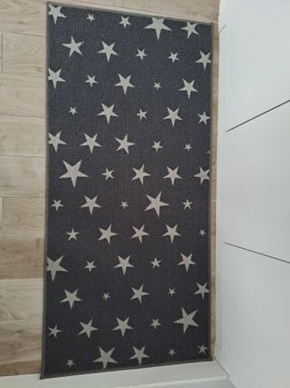 Alfombra gris estrellas