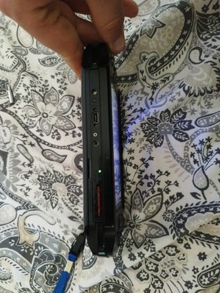 Psp street e-1000 avariada com sd 4 gb