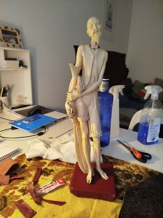 escultura pescador chino siglo XX