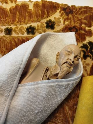 escultura pescador chino siglo XX