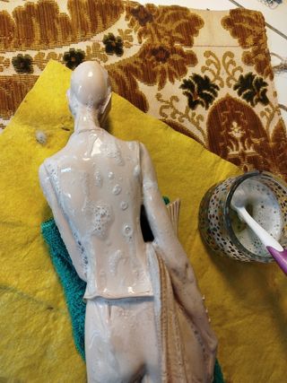 escultura pescador chino siglo XX