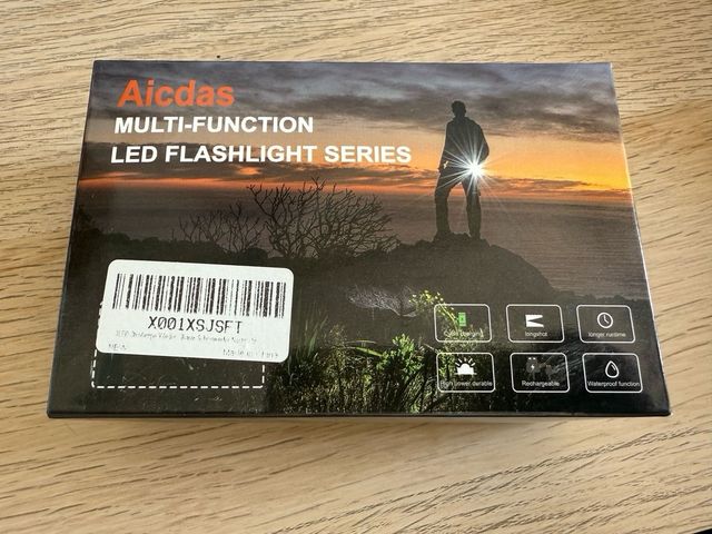 Linterna frontal con estuche y luz de lectura