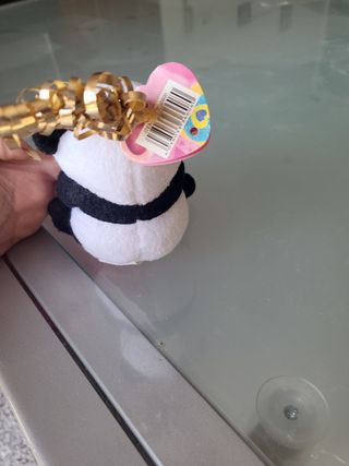 Peluche panda con etichetta