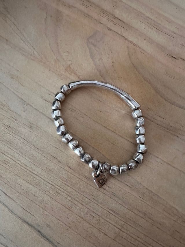 Pulsera de bolitas  uno de 50 .