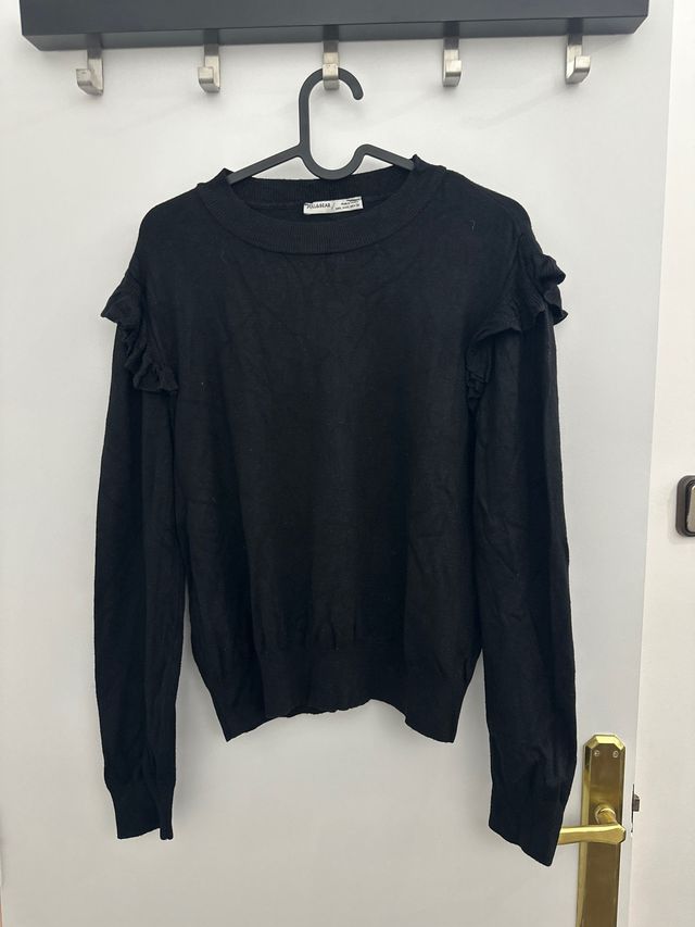 Jersey negro con flecos