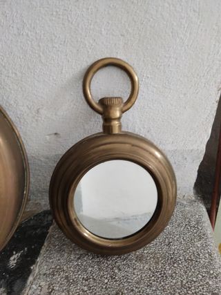 Espejos dorados de latón